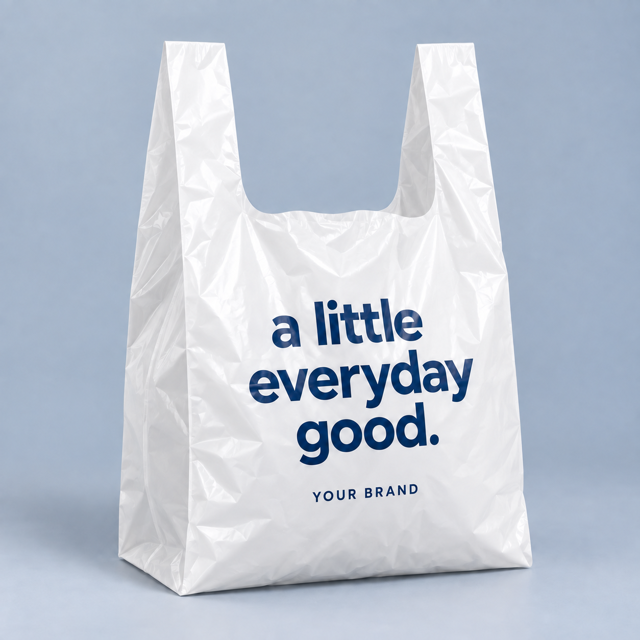 Classic T-shirt plastic bag with integral handles and a deep U-shaped opening